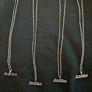 Women's 20 inch .925 Sterling Silver and Rhodium necklace with charm.